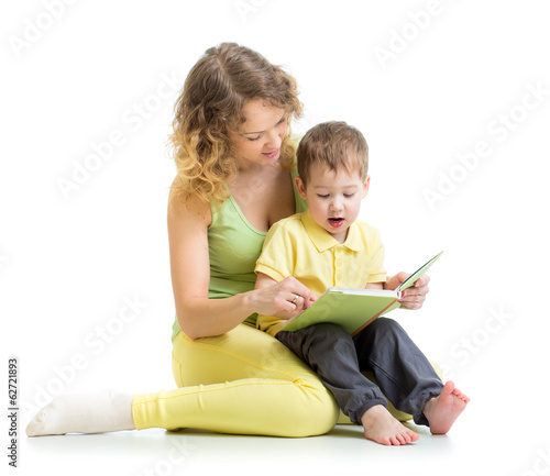 Photo: mother reading a book to her child boy mother reading a book to her child boy