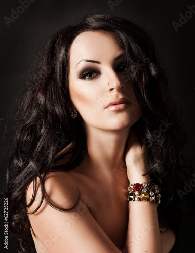 Photo: Young fasion woman with long hair and jewelry Young fasion woman with long hair and jewelry