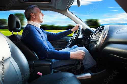 Photo: Man driving a car Man driving a car
