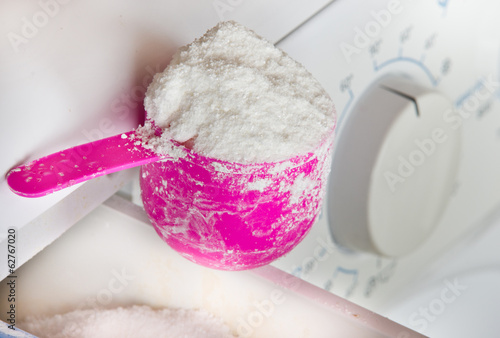 Photo: Cup with laundry detergent Cup with laundry detergent