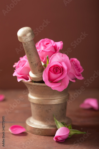 Photo: mortar with rose flowers for aromatherapy and spa mortar with rose flowers for aromatherapy and spa