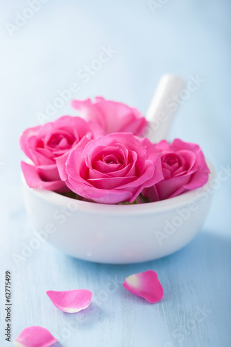 Photo: pink rose flowers in mortar for aromatherapy and spa pink rose flowers in mortar for aromatherapy and spa