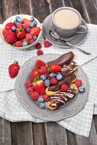 Photo: Chocolate eclairs with fresh berries Chocolate eclairs with fresh berries