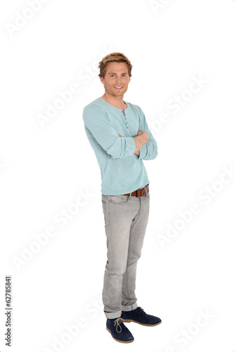 Photo: Young man with arms crossed on white background Young man with arms crossed on white background