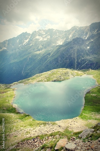 Photo: Lake in Italian Alps, Stelvio National Park. Cross processed. Lake in Italian Alps, Stelvio National Park. Cross processed.