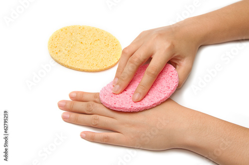 Photo: young hand spa scrubbing hand with sponge young hand spa scrubbing hand with sponge