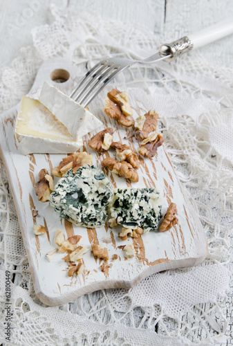 Photo: Cutting board with Camembert, blue cheese and walnut Cutting board with Camembert, blue cheese and walnut