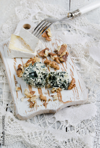 Photo: Cutting board with Camembert, blue cheese and walnut Cutting board with Camembert, blue cheese and walnut