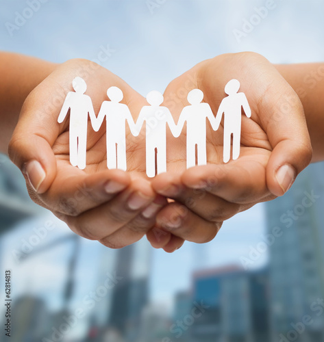 Photo: womans hands with paper team womans hands with paper team