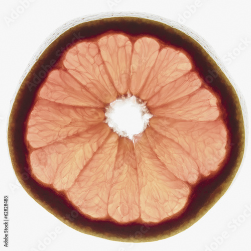 Photo: Slice of organic ruby red grapefruit on white background Slice of organic ruby red grapefruit on white background