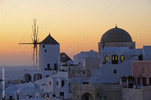 Photo: The historic white washed houses, windmills and domed church of Oia town on Santorini island The historic white washed houses, windmills and domed church of Oia town on Santorini island