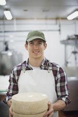 Photo: A small organic dairy farm with a mixed herd of cows and goats. Dairy building with large wheels of cheese maturing. Trays of produce. A small organic dairy farm with a mixed herd of cows and goats. Dairy building with large wheels of cheese maturing. Trays of produce.