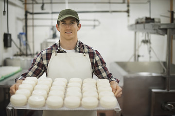 Photo: A small organic dairy farm with a mixed herd of cows and goats. Dairy building with large wheels of cheese maturing. Trays of produce. A small organic dairy farm with a mixed herd of cows and goats. Dairy building with large wheels of cheese maturing. Trays of produce.
