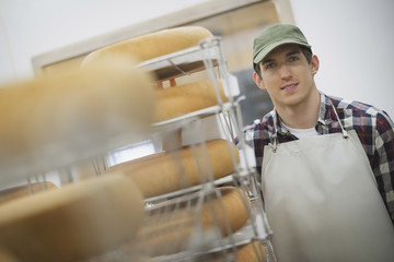 Photo: A small organic dairy farm with a mixed herd of cows and goats. Dairy building with large wheels of cheese maturing. Trays of produce. A small organic dairy farm with a mixed herd of cows and goats. Dairy building with large wheels of cheese maturing. Trays of produce.