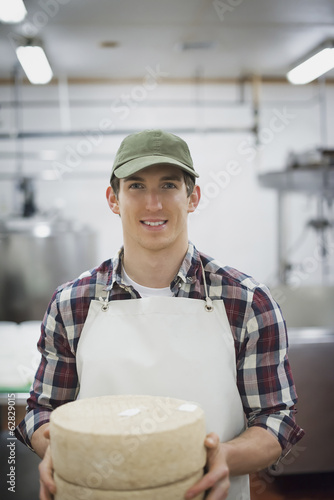 Photo: A small organic dairy farm with a mixed herd of cows and goats. Dairy building with large wheels of cheese maturing. Trays of produce. A small organic dairy farm with a mixed herd of cows and goats. Dairy building with large wheels of cheese maturing. Trays of produce.
