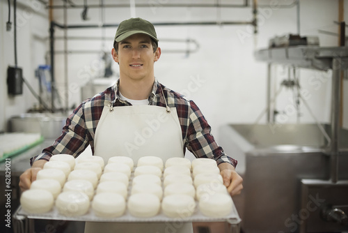 Photo: A small organic dairy farm with a mixed herd of cows and goats. Dairy building with large wheels of cheese maturing. Trays of produce. A small organic dairy farm with a mixed herd of cows and goats. Dairy building with large wheels of cheese maturing. Trays of produce.