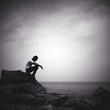 man sitting alone on the beach man sitting alone on the beach