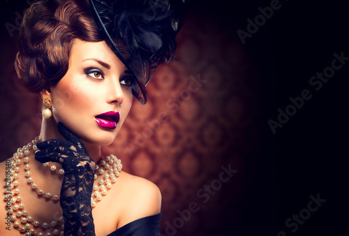 Photo: Retro Woman. Vintage Styled Girl with Retro Hairstyle and Makeup Retro Woman. Vintage Styled Girl with Retro Hairstyle and Makeup