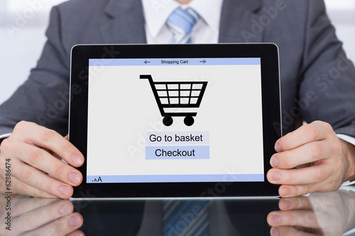 Photo: Businessperson Showing Online Shopping Application Businessperson Showing Online Shopping Application