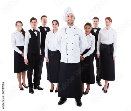 Photo: Chef standing in front of his team Chef standing in front of his team