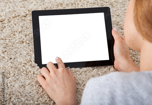 Photo: Woman Using Digital Tablet Woman Using Digital Tablet