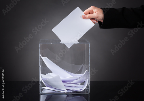 Photo: Hand Putting Ballot In Box Hand Putting Ballot In Box