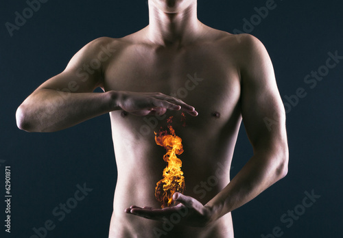 Photo: Pain in the abdomen or in the stomach of man. Heartburn. Pain in the abdomen or in the stomach of man. Heartburn.
