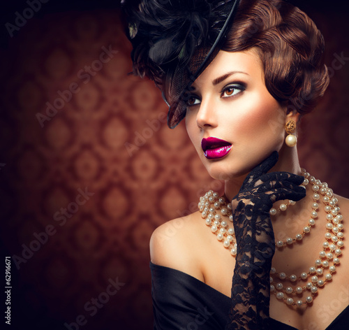 Photo: Retro Woman. Vintage Styled Girl with Retro Hairstyle and Makeup Retro Woman. Vintage Styled Girl with Retro Hairstyle and Makeup