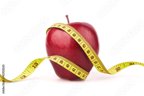 Photo: Red apple with yellow measuring tape Red apple with yellow measuring tape