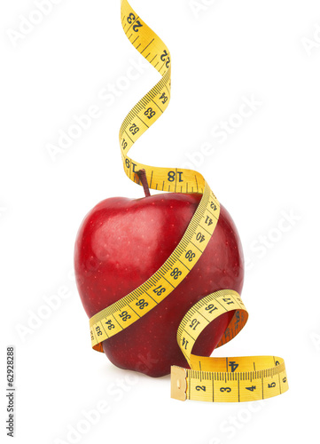 Photo: Red apple with yellow measuring tape Red apple with yellow measuring tape