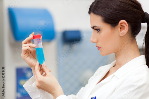 Photo: Female scientist doing a test in a laboratory Female scientist doing a test in a laboratory