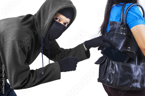 Photo: Thief stealing cell phone Thief stealing cell phone