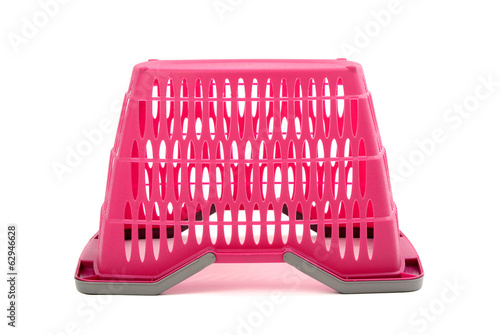 Photo: Pink plastic shopping basket.Closeup on empty market basket. Pink plastic shopping basket.Closeup on empty market basket.