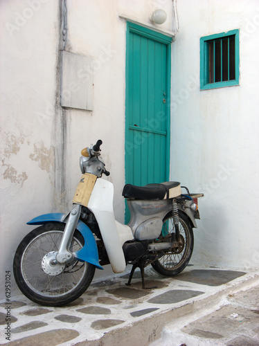 Photo: Old Italian Motorbike and Green Wooden Door Old Italian Motorbike and Green Wooden Door