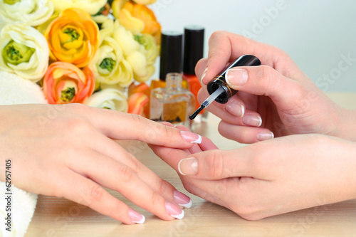 Photo: Manicure process in beauty salon close up Manicure process in beauty salon close up