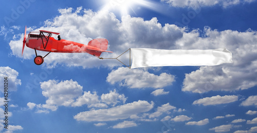 Photo: biplano rosso con striscione biplano rosso con striscione