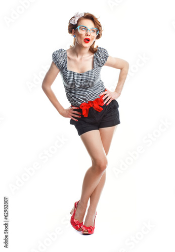 Photo: Surprised or amazedly young woman standing Surprised or amazedly young woman standing