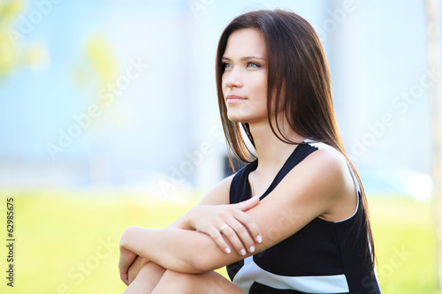 Photo: young beautiful smiling business woman outdoors sitting young beautiful smiling business woman outdoors sitting