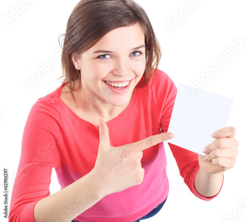 Photo: Woman showing empty blank paper sign board Woman showing empty blank paper sign board