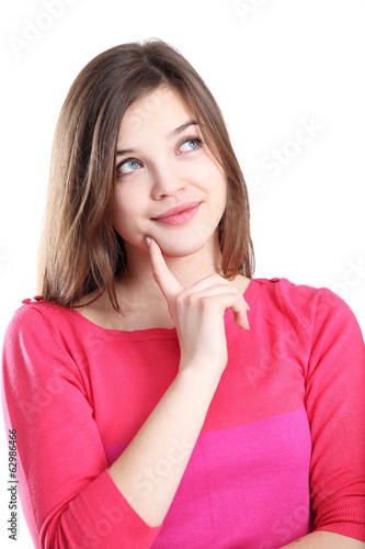 Photo: Beautiful thoughtful woman looking up - isolated over white Beautiful thoughtful woman looking up - isolated over white