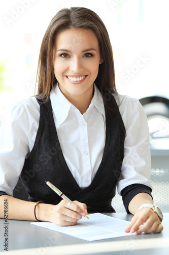 Photo: Modern business woman in the office Modern business woman in the office