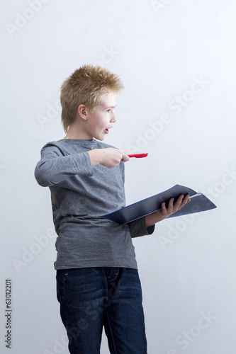 Photo: Boy proves the case of knowledge Boy proves the case of knowledge