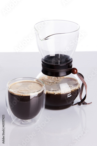 Photo: Cup of coffee and chemex. Shallow dof. Cup of coffee and chemex. Shallow dof.