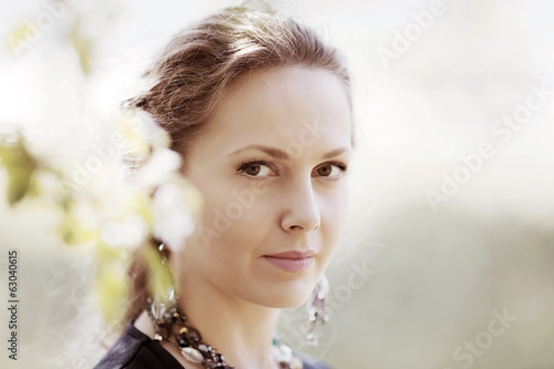 Photo: Beautiful woman in a spring garden Beautiful woman in a spring garden