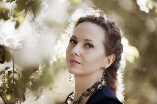 Photo: Beautiful woman in a spring garden Beautiful woman in a spring garden