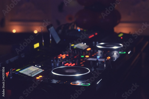 Photo: Disc Jockey mixing deck and turntables Disc Jockey mixing deck and turntables