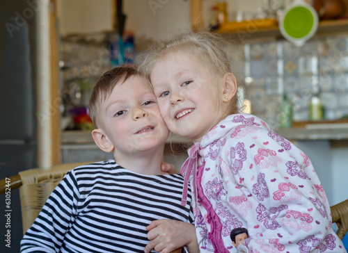 Photo: Cute little brother and sister posing together Cute little brother and sister posing together