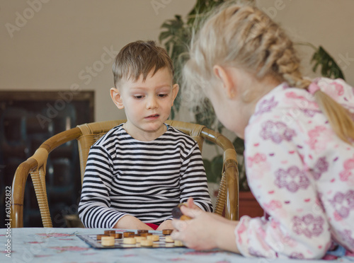 Photo: Cute little boy pulling a face and grimacing Cute little boy pulling a face and grimacing