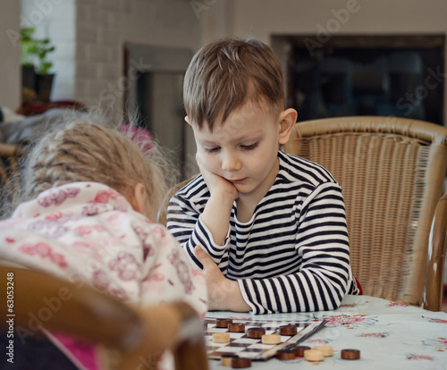 Photo: Little boy planning his strategy Little boy planning his strategy