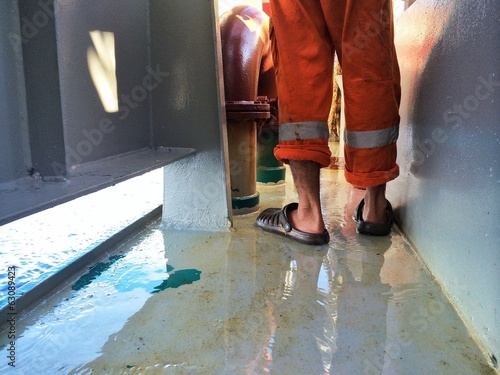 Instant Collection: An offshore crew working with improper safety gear An offshore crew working with improper safety gear